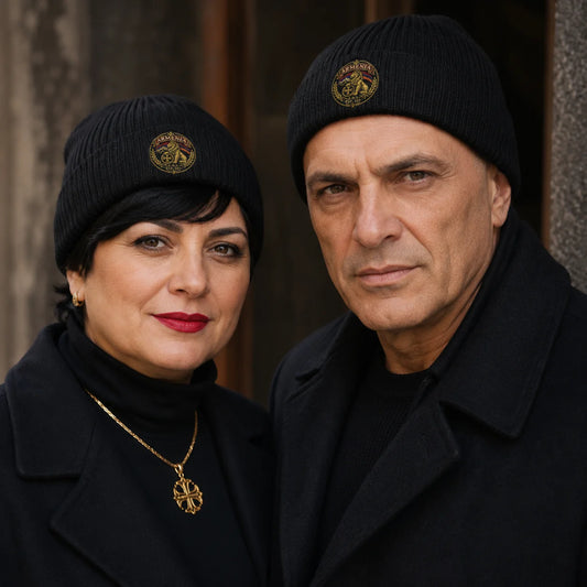 Man and woman wearing matching black Armenia lion crest beanies