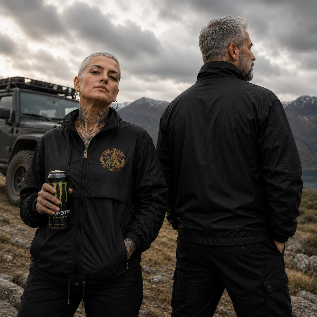 Armenian Pride windbreaker jacket featuring front and back design on tattooed middle-aged couple outdoors
