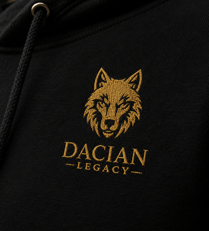 Gold embroidered Dacian wolf logo on black hoodie chest