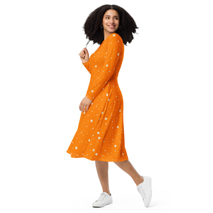 Orange and white polka dot midi dress styled with sneakers