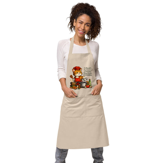 Organic cotton kitchen apron featuring cartoon cat cooking illustration
